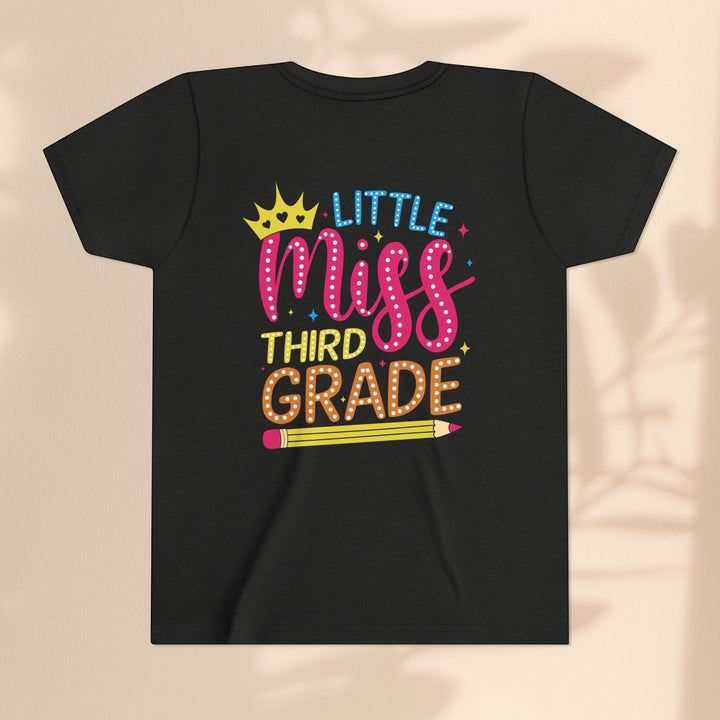 Sea Dragon Dreams black youth t-shirt with Little Miss Third Grade graphic featuring a crown and pencil design.