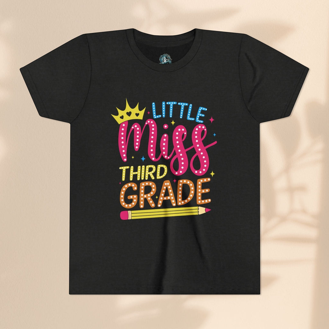 Sea Dragon Dreams black youth t-shirt with Little Miss Third Grade graphic featuring a crown and pencil design.