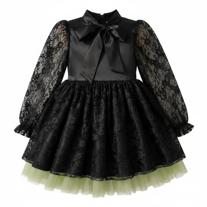 Sea Dragon Dreams girls' black satin witch dress with lace sleeves, bow neckline, and green tulle hem for Halloween.