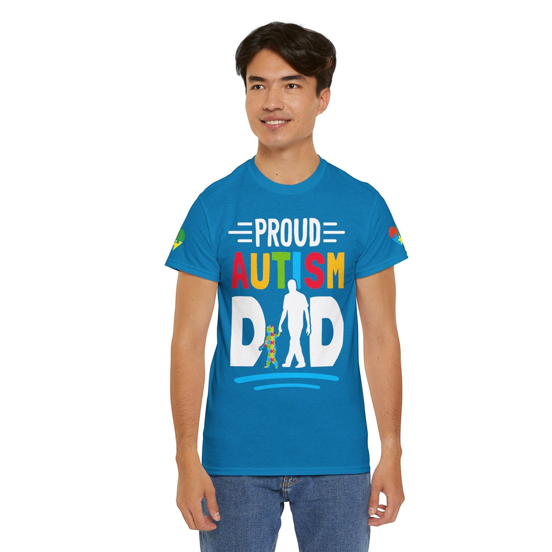 Sea Dragon Dreams blue heavy cotton t-shirt with Proud Autism Dad graphic worn by a smiling man.