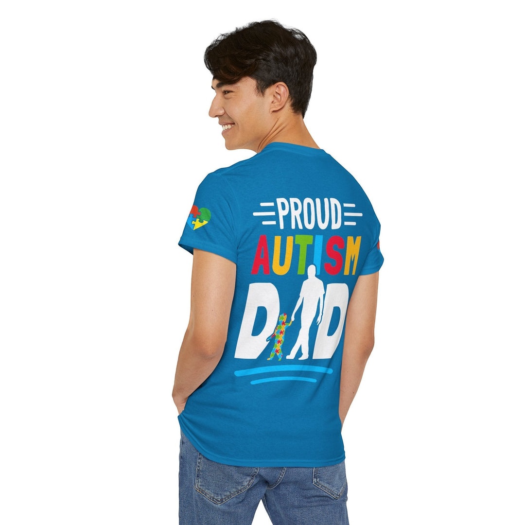 Sea Dragon Dreams blue heavy cotton t-shirt with Proud Autism Dad graphic on the back, worn by a man from behind.