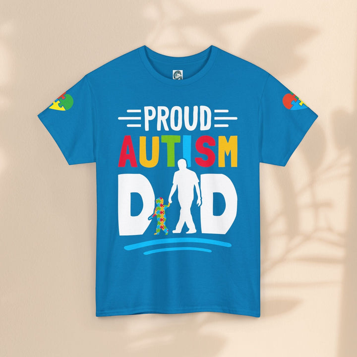 Sea Dragon Dreams blue heavy cotton t-shirt with a colorful Proud Autism Dad graphic and puzzle piece design.