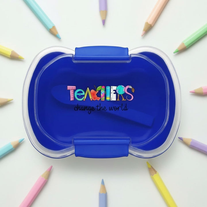 Sea Dragon Dreams blue two-tier bento box with Teachers Change The World design, surrounded by colorful pencils.