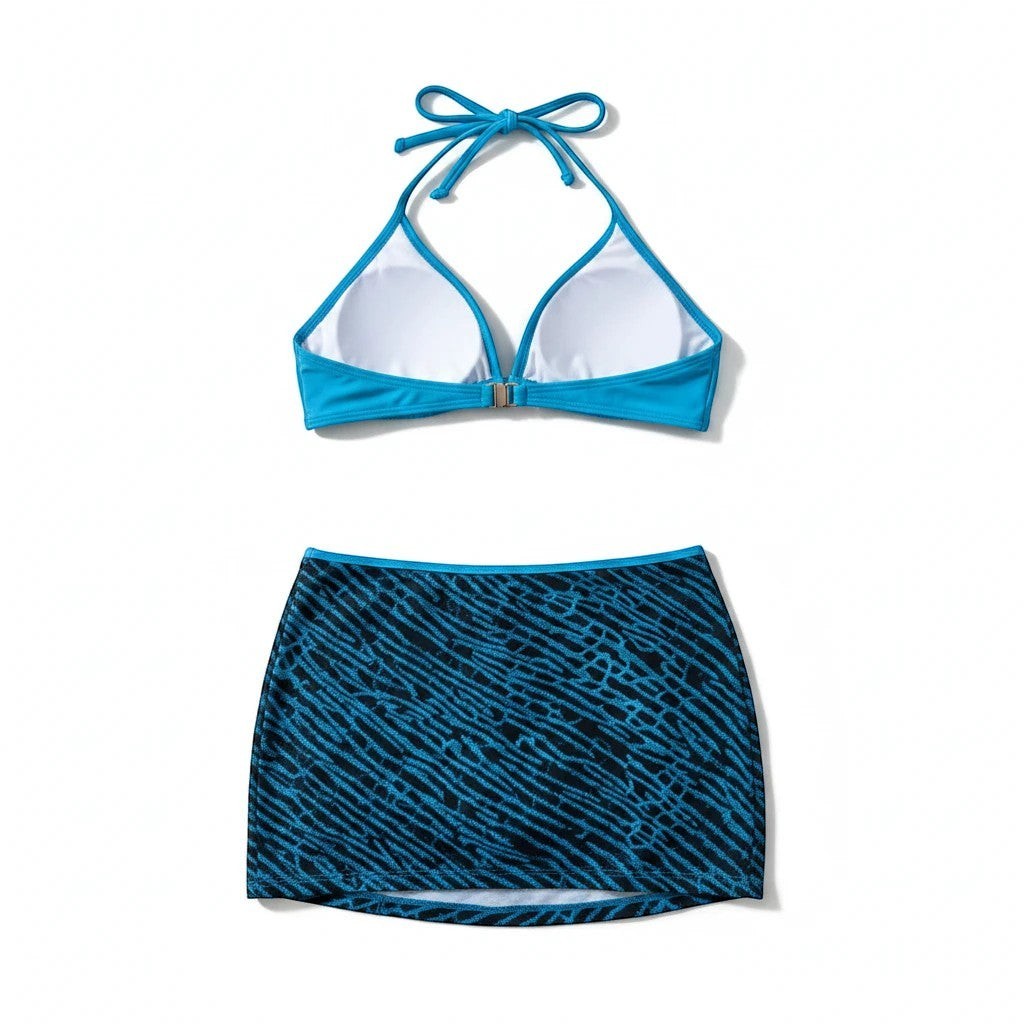 Sea Dragon Dreams bikini set featuring a blue halter top and a matching blue and black patterned skirt cover-up