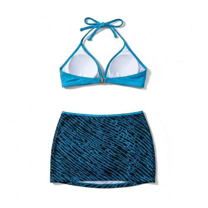 Sea Dragon Dreams bikini set featuring a blue halter top and a matching blue and black patterned skirt cover-up