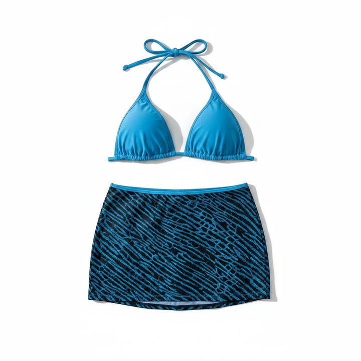Sea Dragon Dreams 3-piece bikini set with a solid blue halter top and a patterned blue and black skirt cover-up.