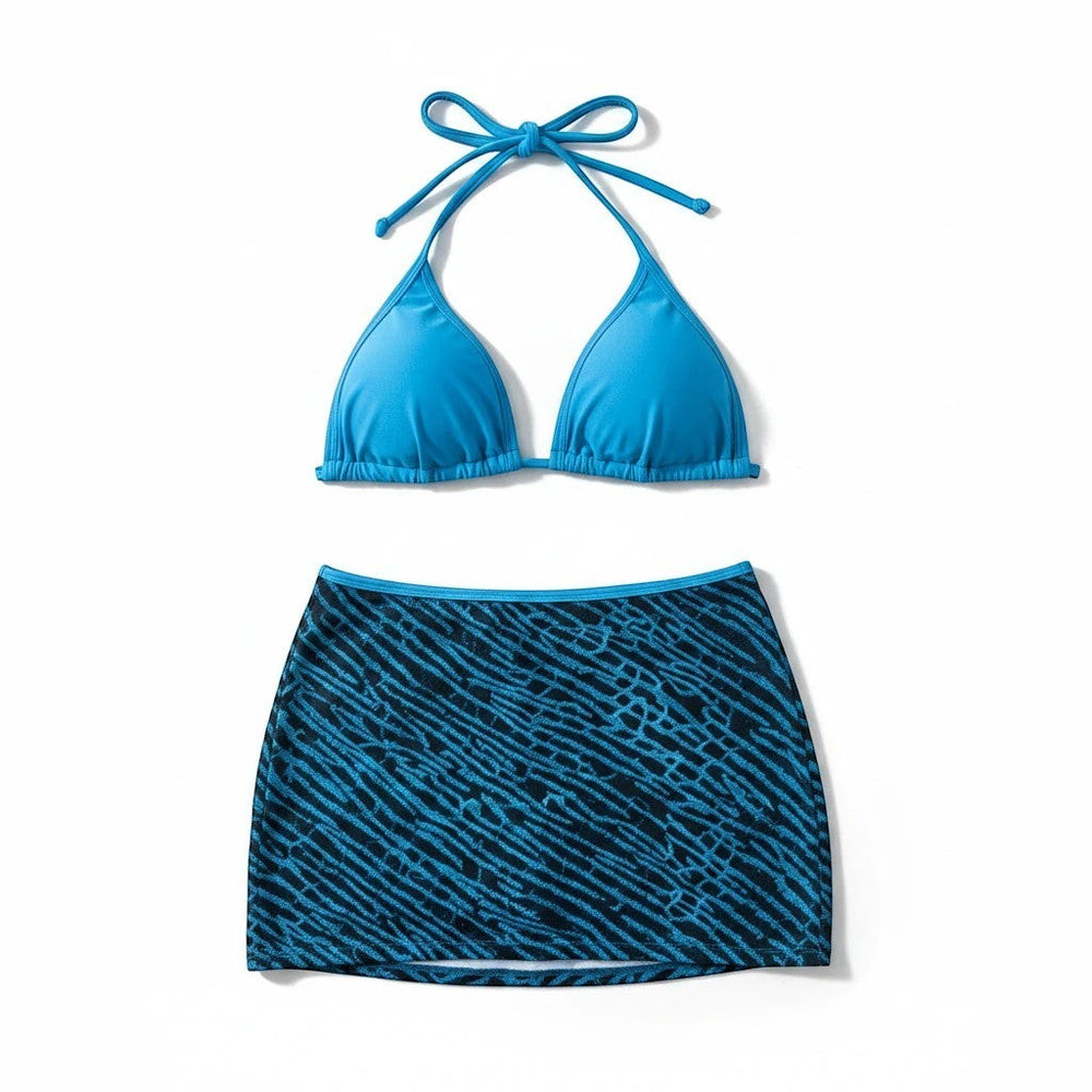 Sea Dragon Dreams blue bikini top paired with a matching blue and black patterned skirt cover-up for beachwear.