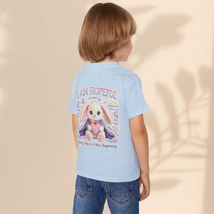 Sea Dragon Dreams toddler t-shirt in light blue featuring a cute bunny graphic with the text I Am Hopeful