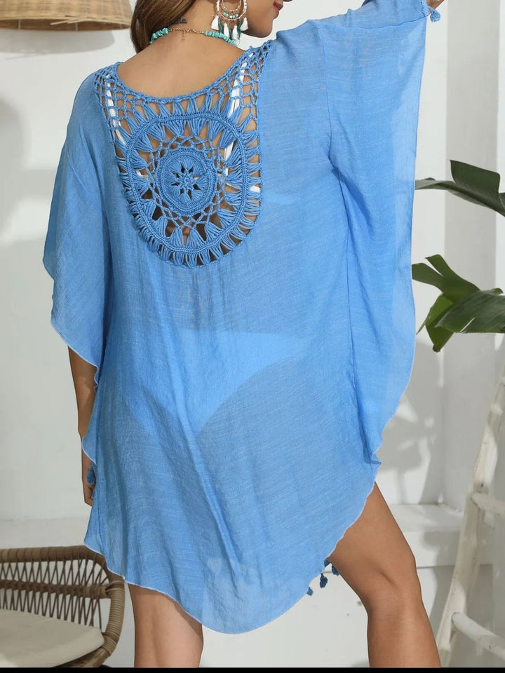 Sea Dragon Dreams blue crochet beach cover-up with intricate back cutout detail and tassel hem