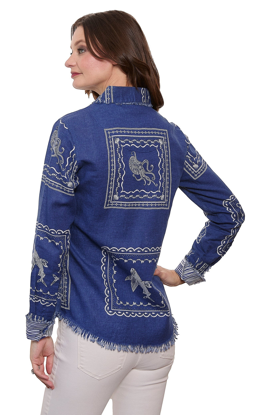 Sea Dragon Dreams blue denim blouse with white nautical sealife print, frayed hem, and long sleeves on a model.