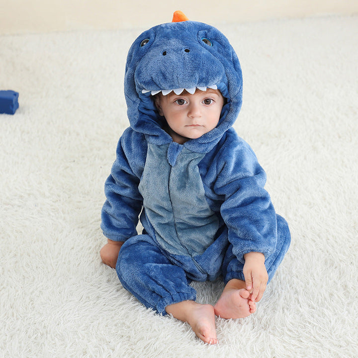 Sea Dragon Dreams blue dragon hooded flannel onesie worn by a toddler sitting on a white rug
