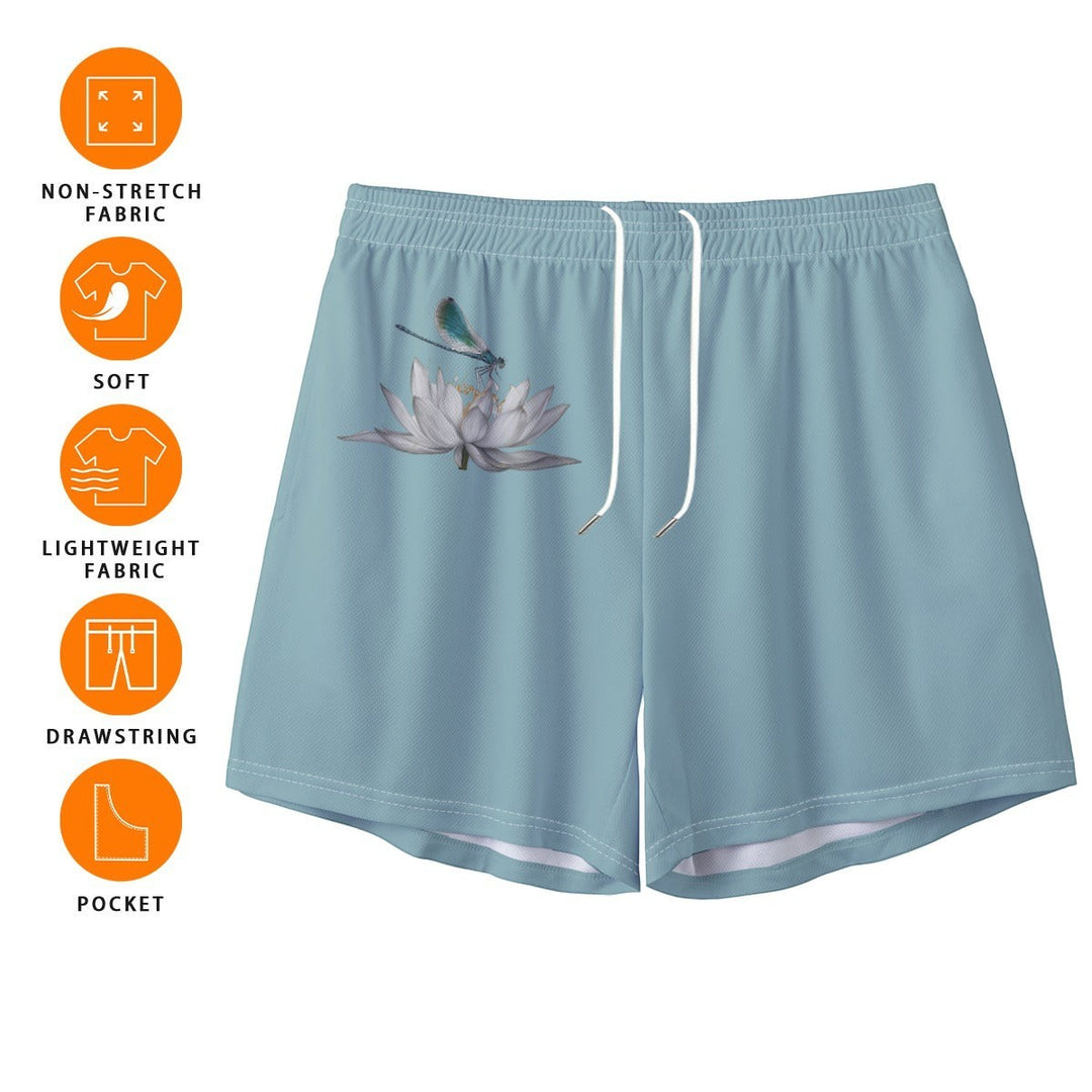 Sea Dragon Dreams men's light blue swim shorts featuring a dragonfly and lotus flower print with an elastic drawstring