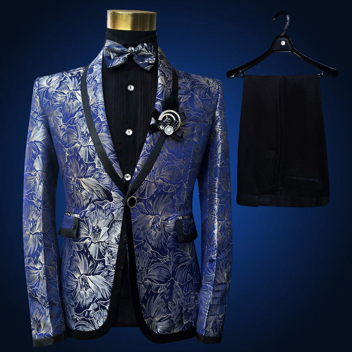 Sea Dragon Dreams four-piece tuxedo suit featuring a blue floral embroidered blazer with black lapels and bowtie.
