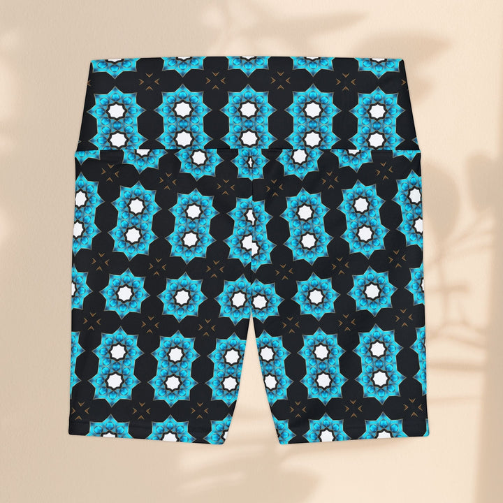 Sea Dragon Dreams women's workout shorts in a black and blue floral pattern made from lightweight polyester fabric.