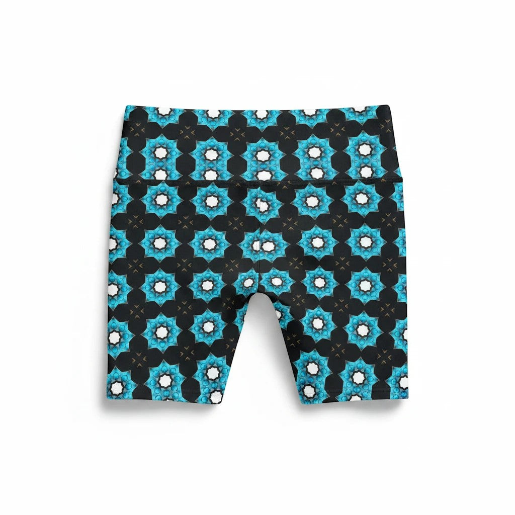Sea Dragon Dreams women's workout shorts featuring a vibrant blue floral geometric pattern on black polyester fabric.