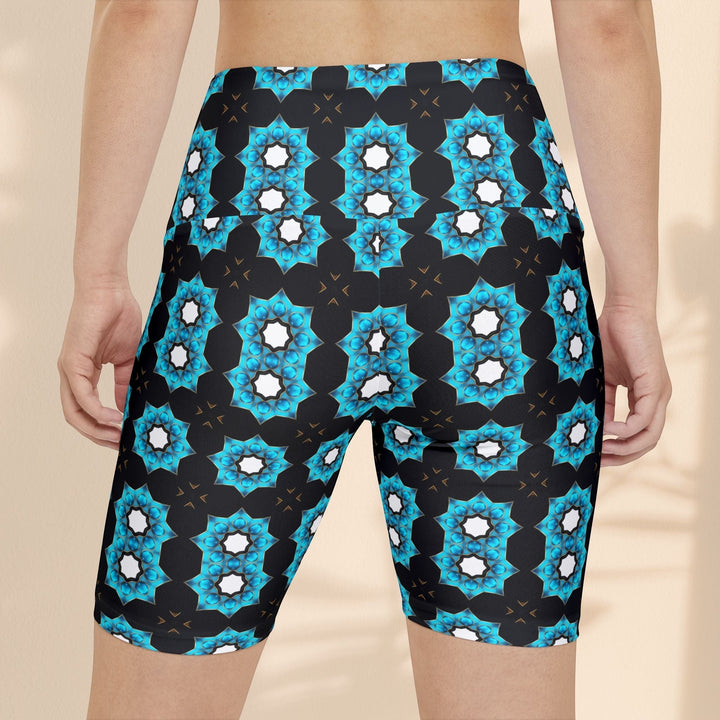 Sea Dragon Dreams women's workout shorts featuring a vibrant blue floral pattern on black, lightweight polyester fabric.