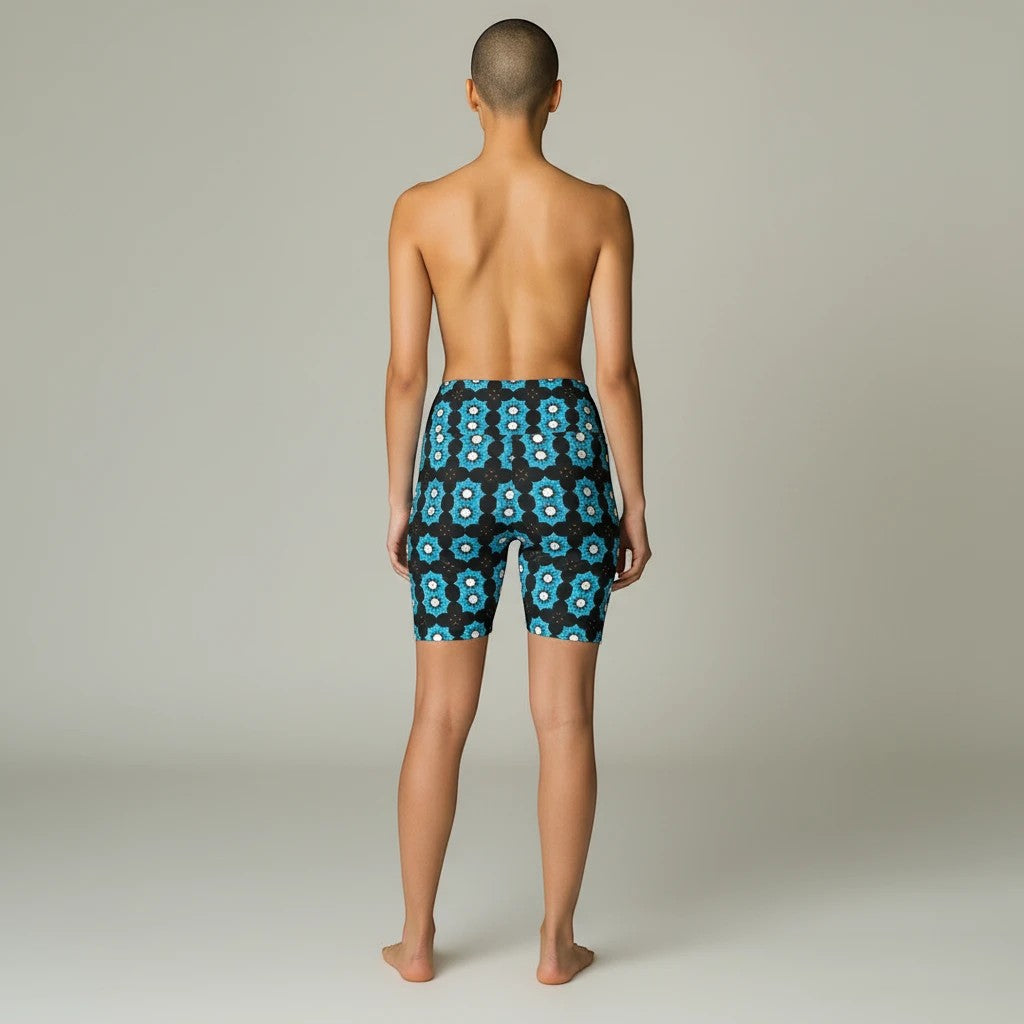 Sea Dragon Dreams women's workout shorts with a blue floral pattern, featuring a comfortable polyester stretch fit.