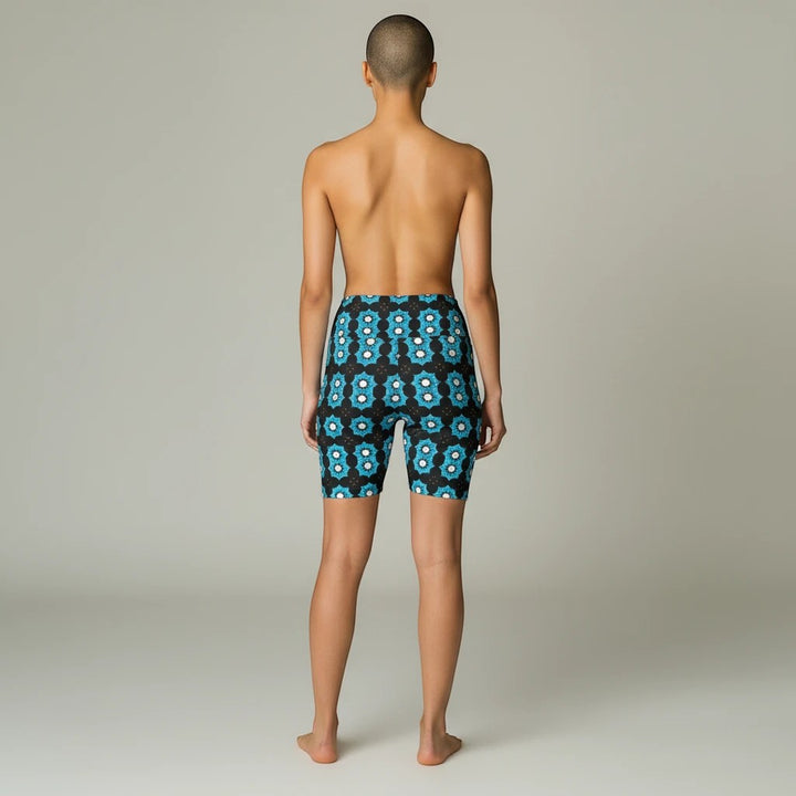 Sea Dragon Dreams women's workout shorts with a blue floral pattern, featuring a comfortable polyester stretch fit.