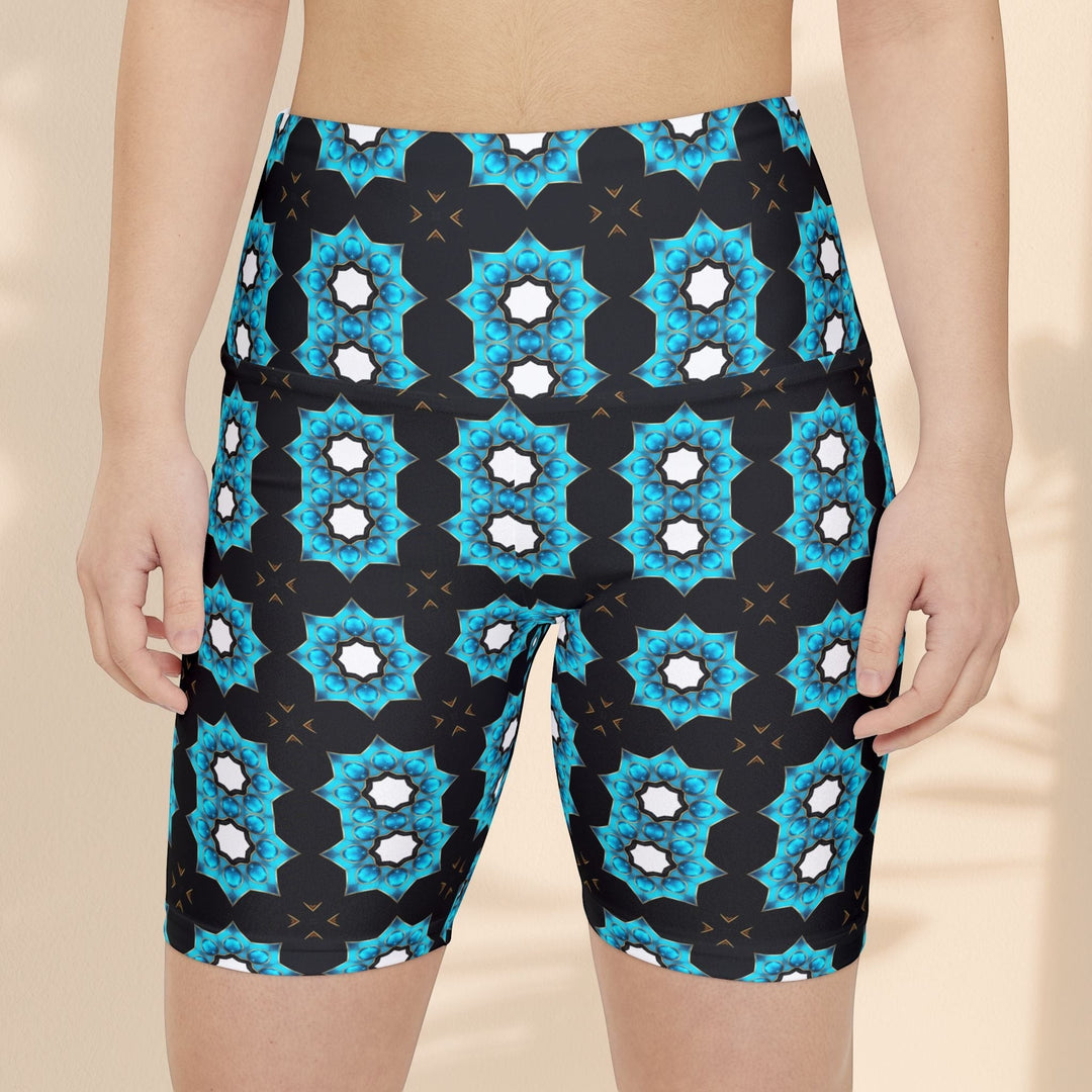 Sea Dragon Dreams women's workout shorts featuring a vibrant blue floral pattern on black polyester fabric.