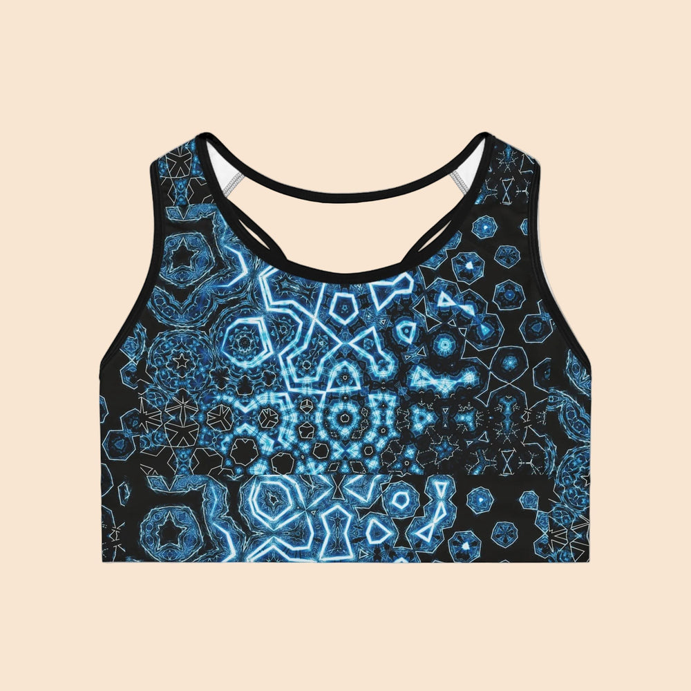 Sea Dragon Dreams Shifting Blues sports bra with a black and blue geometric ocean-inspired pattern and racerback design.