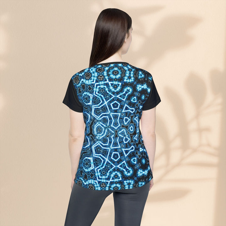Sea Dragon Dreams women's sports jersey with a blue geometric pattern, moisture-wicking polyester, back view.