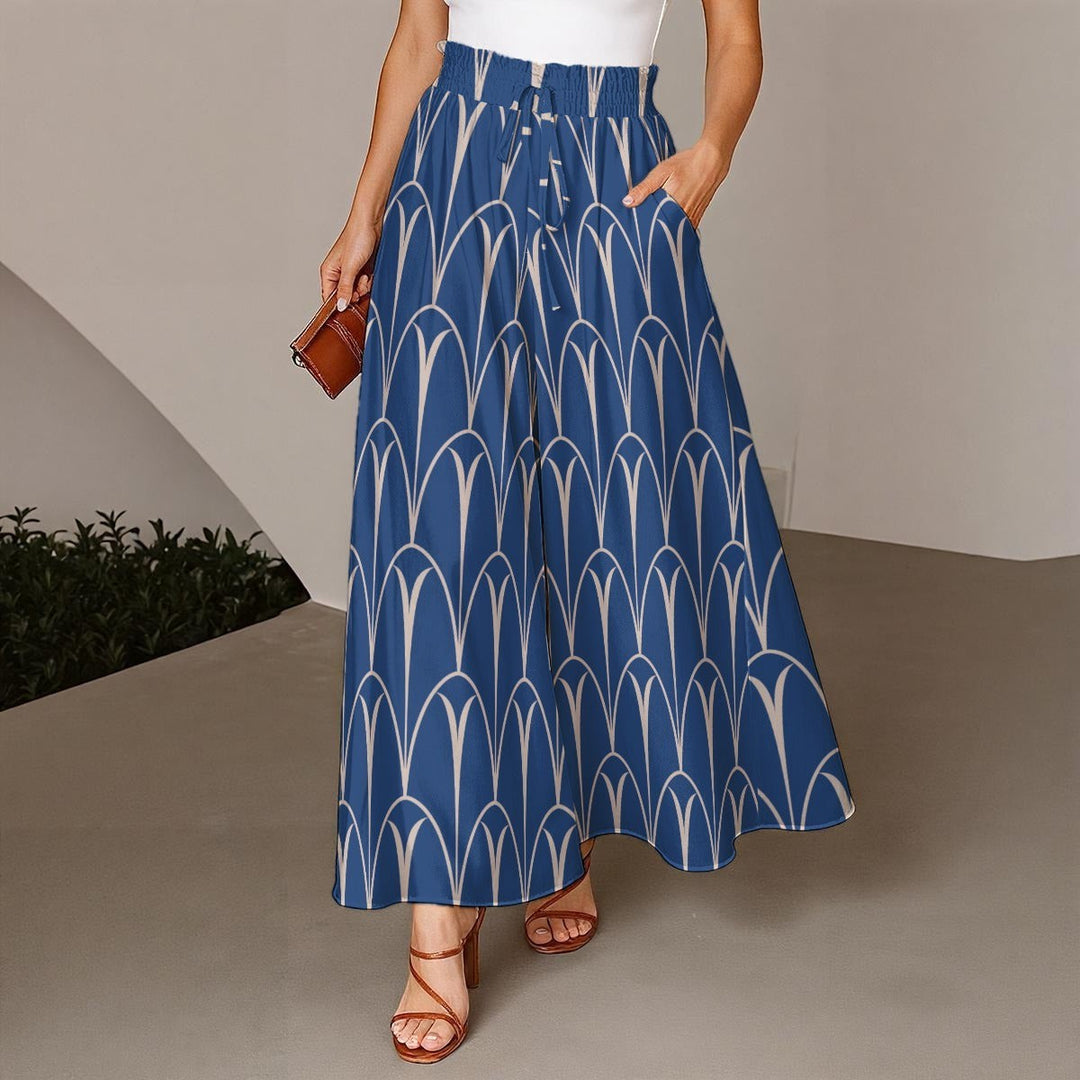 Sea Dragon Dreams blue wide-leg pants with a white geometric arch pattern, elastic drawstring waist, and pockets.