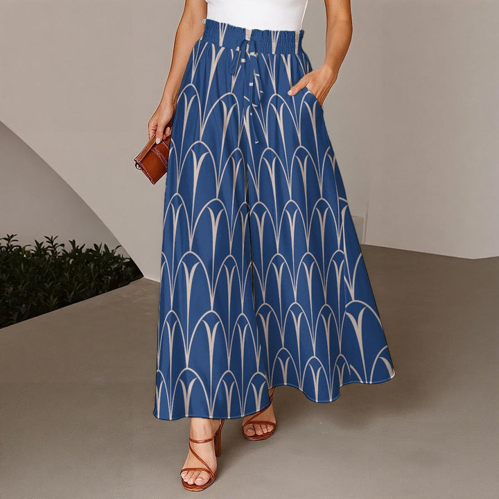 Sea Dragon Dreams blue wide-leg pants with a white geometric arch pattern, elastic drawstring waist, and pockets.