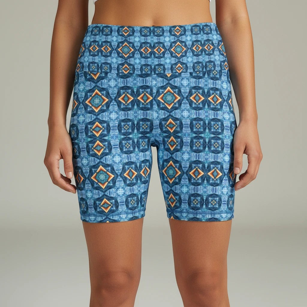 Sea Dragon Dreams Goddess Isis workout shorts in blue with a geometric pattern, featuring a high-waisted fit.