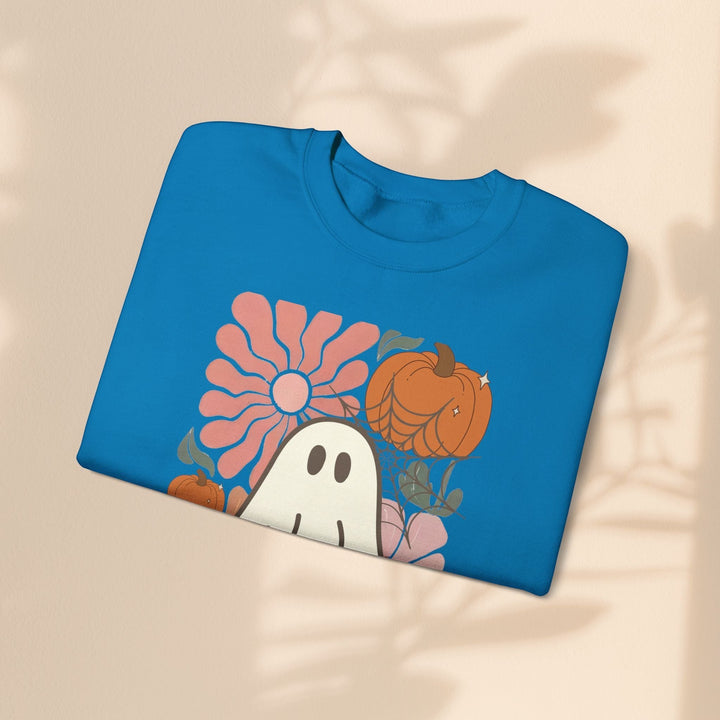 Sea Dragon Dreams blue crewneck sweatshirt featuring a retro ghost, pumpkin, and flower graphic print