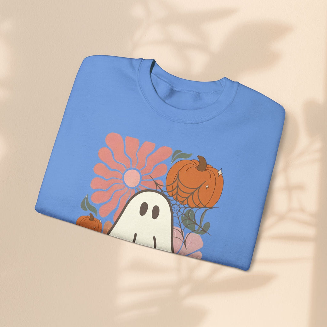Sea Dragon Dreams blue crewneck sweatshirt featuring a retro ghost, pumpkin, and flower graphic for Halloween.