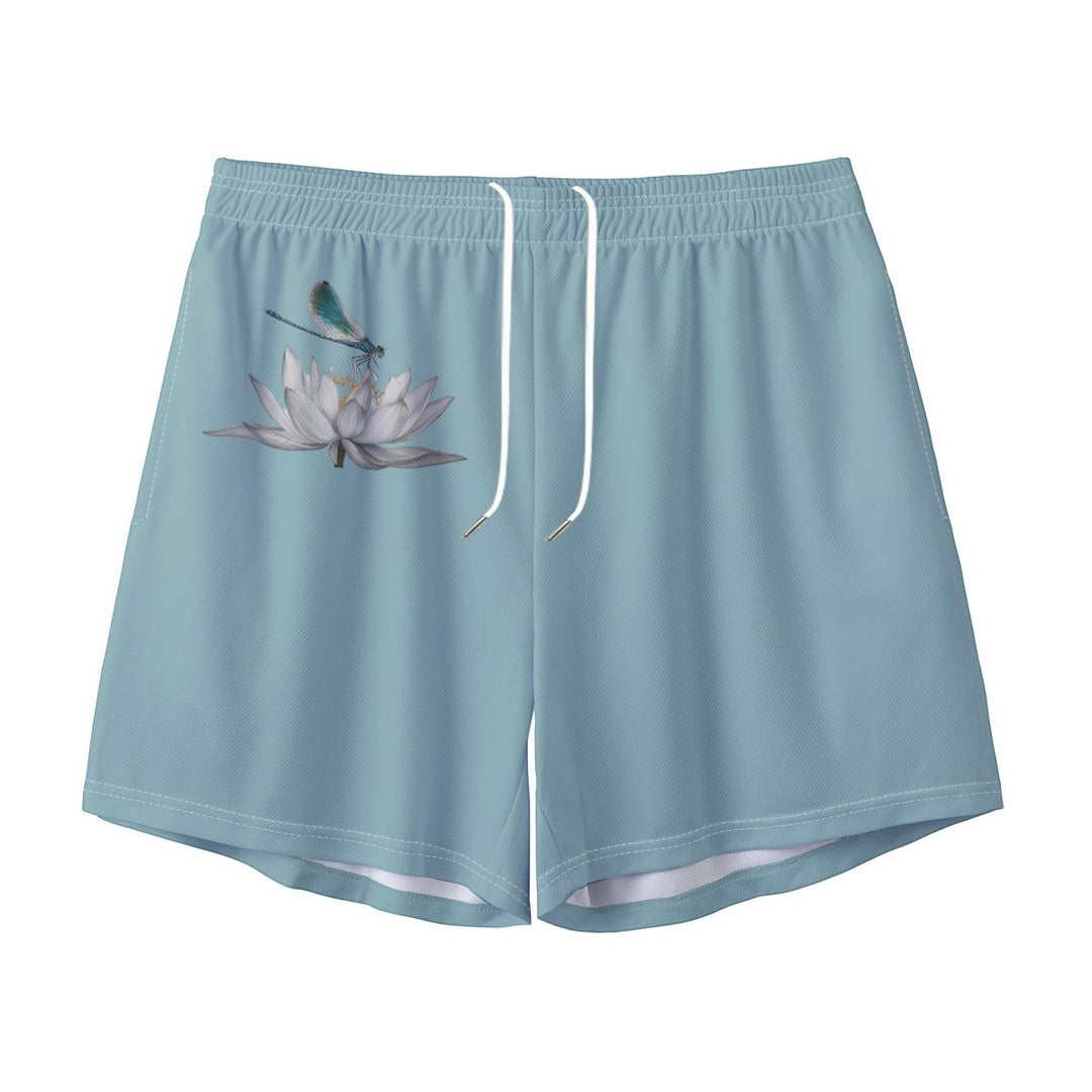 Sea Dragon Dreams men's light blue polyester swim shorts featuring a delicate dragonfly and white lotus flower design.