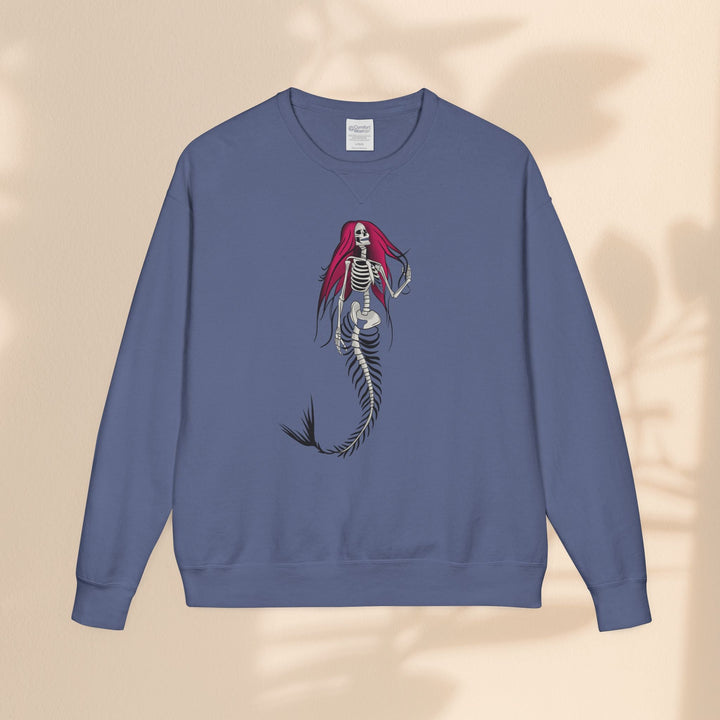 Sea Dragon Dreams crewneck sweatshirt in muted blue with a gothic skeletal mermaid graphic featuring vibrant red hair.