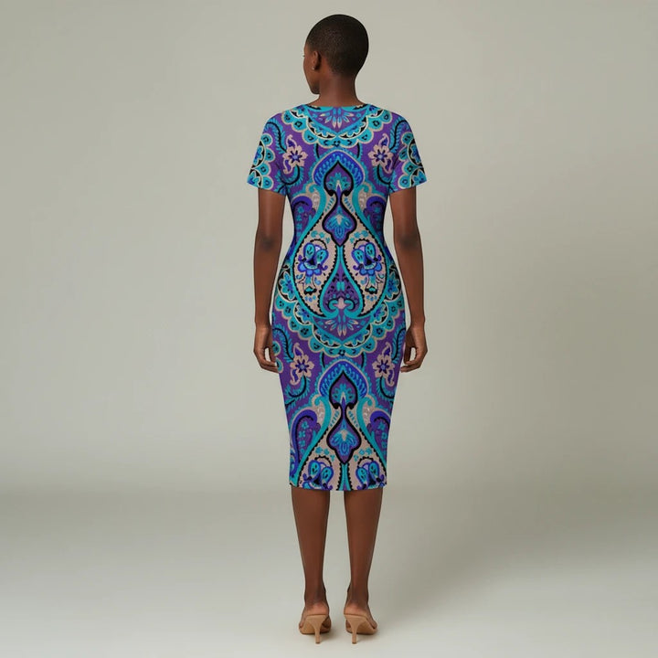 Sea Dragon Dreams blue V-neck dress with a vibrant paisley magic print and side pleats on a model, back view