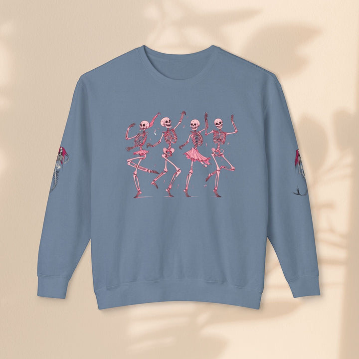 Sea Dragon Dreams blue crewneck sweatshirt featuring a pink dancing skeletons graphic and mermaid sleeve details.