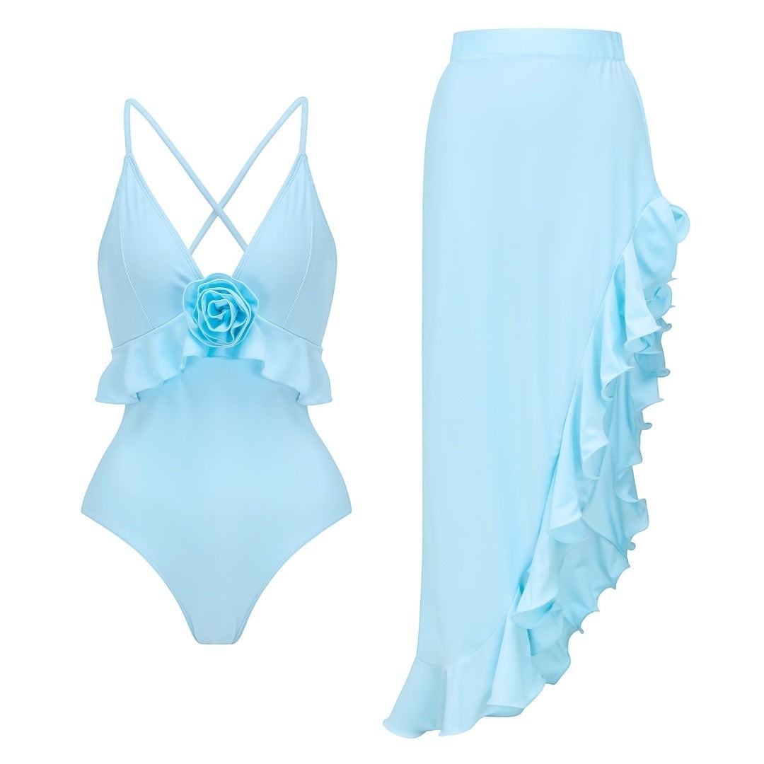 Sea Dragon Dreams light blue one-piece swimsuit with a floral bow accent and a matching ruffled sarong skirt
