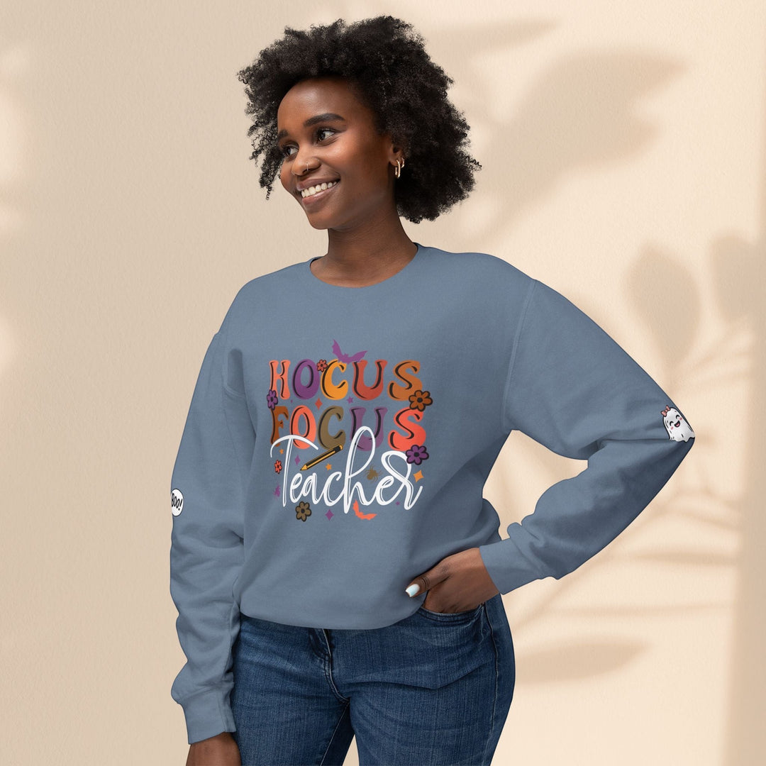Sea Dragon Dreams blue crewneck sweatshirt with Hocus Focus Teacher graphic, worn by a smiling woman.