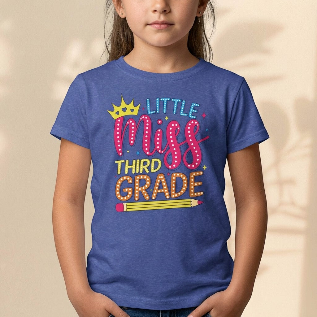 Sea Dragon Dreams blue youth t-shirt with Little Miss Third Grade graphic featuring a crown and pencil design.