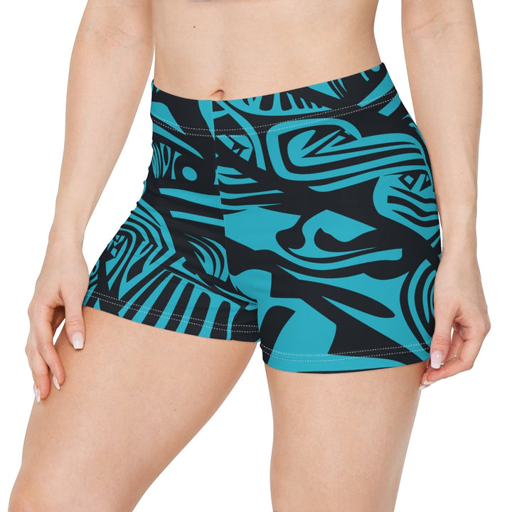 Sea Dragon Dreams women's skinny fit shorts in blue with a bold black tribal print, made from moisture-wicking fabric.