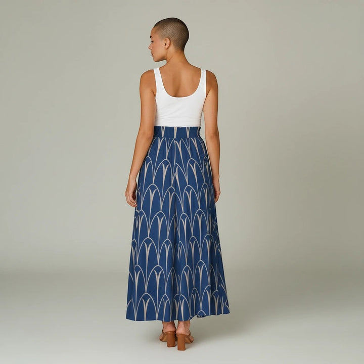 Sea Dragon Dreams blue wide-leg pants with a white geometric print, featuring an elastic waistband and flowy fit.