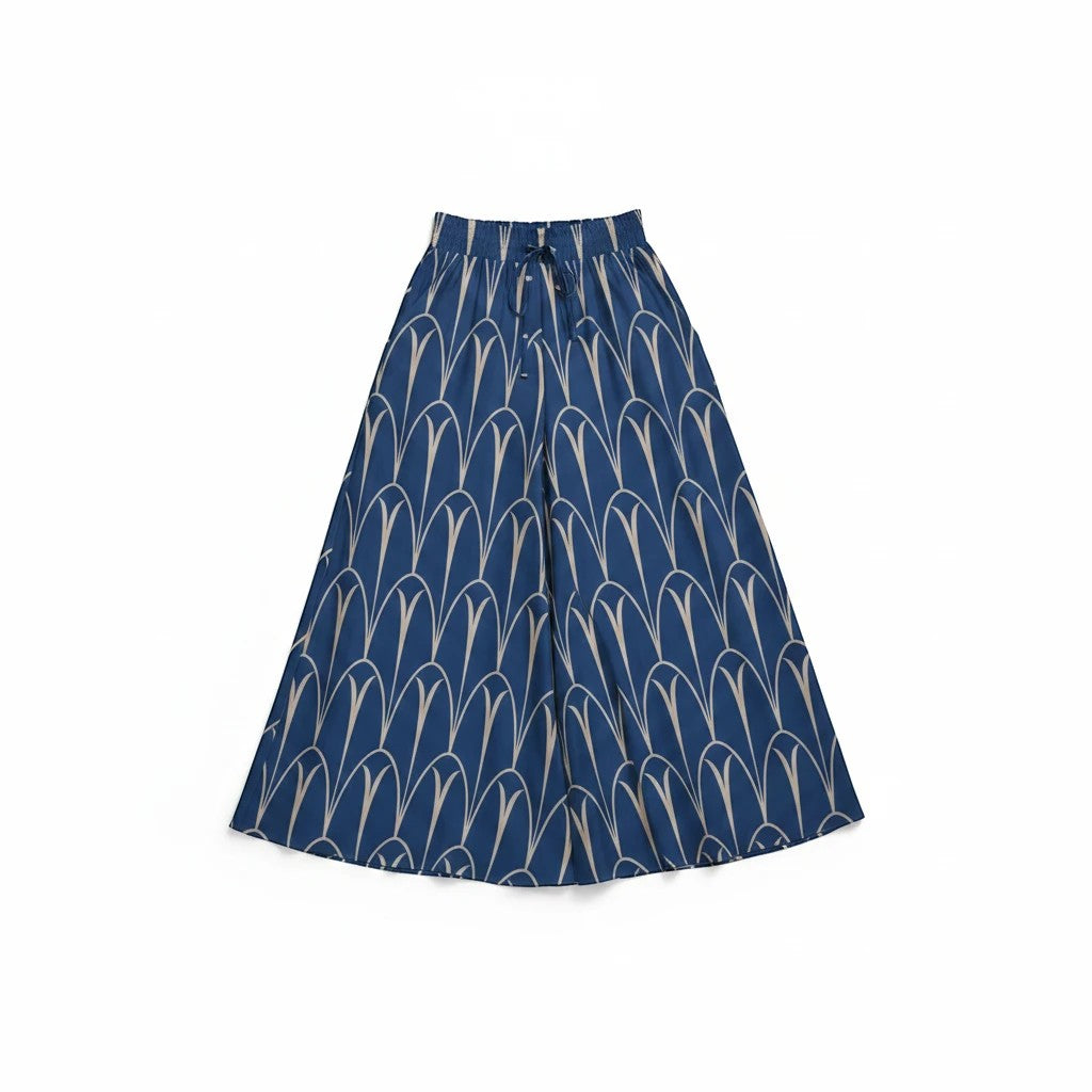 Sea Dragon Dreams blue wide-leg pants with a cream geometric arch pattern, featuring an elastic drawstring waistband.