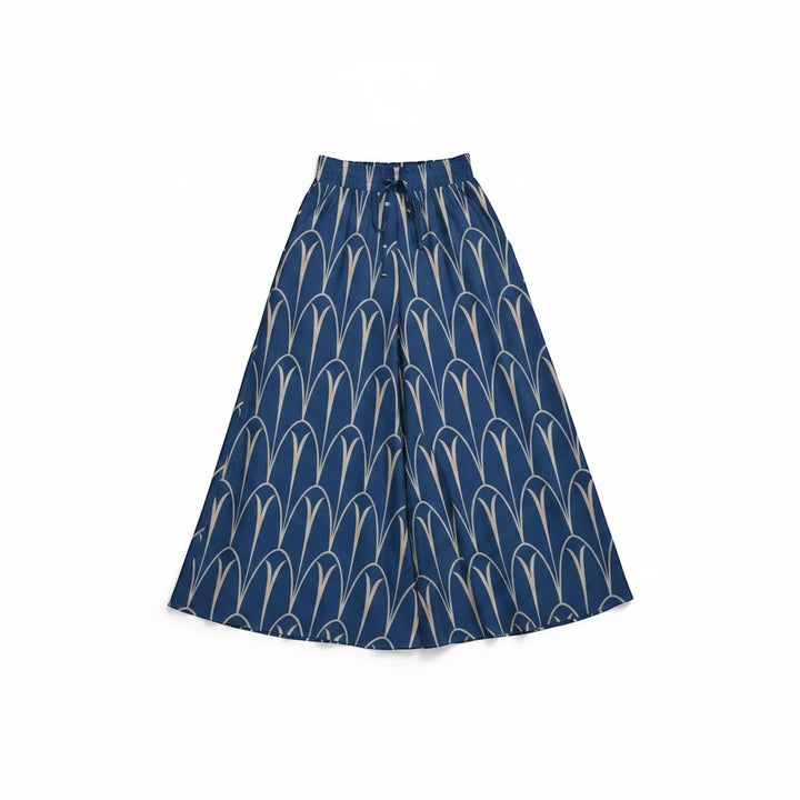 Sea Dragon Dreams blue wide-leg pants with a cream geometric arch pattern, featuring an elastic drawstring waistband.