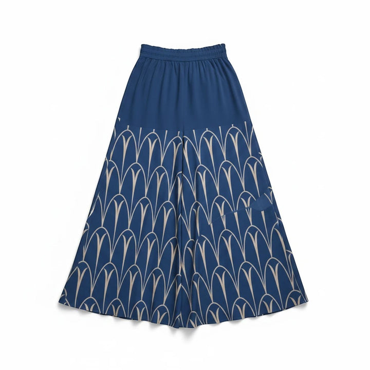 Sea Dragon Dreams blue wide-leg pants with a cream-colored geometric arch pattern and an elastic drawstring waist.