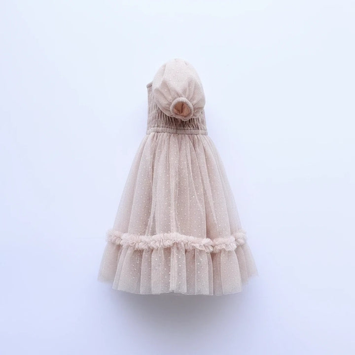 Sea Dragon Dreams toddler girl blush tulle party dress with smocked bodice, puff sleeves, and ruffled hem.
