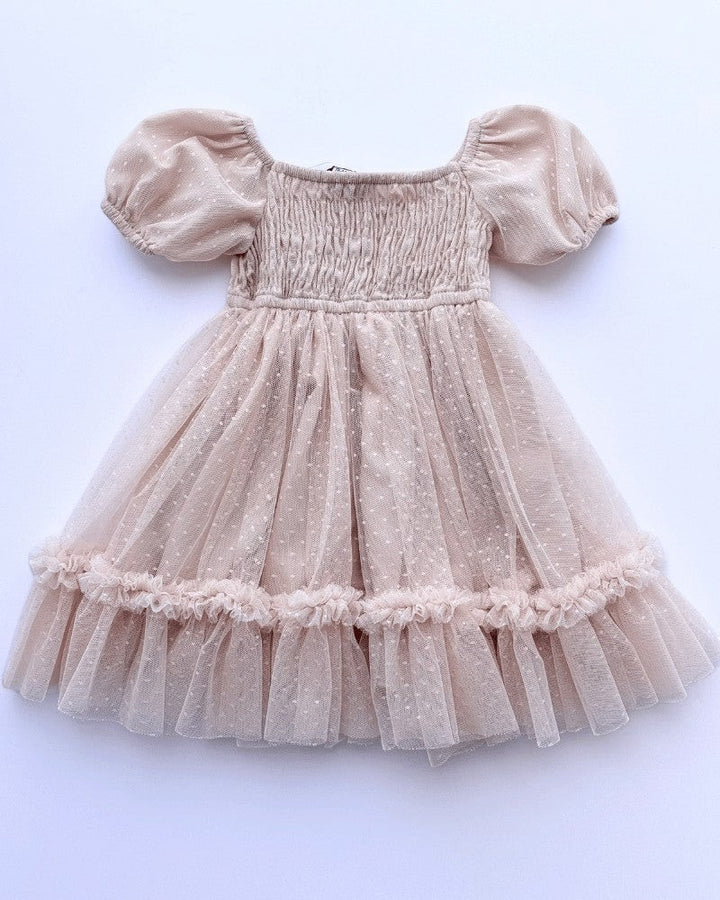 Sea Dragon Dreams toddler girl blush tulle party dress with smocked bodice, puff sleeves, and shimmering polka dots.