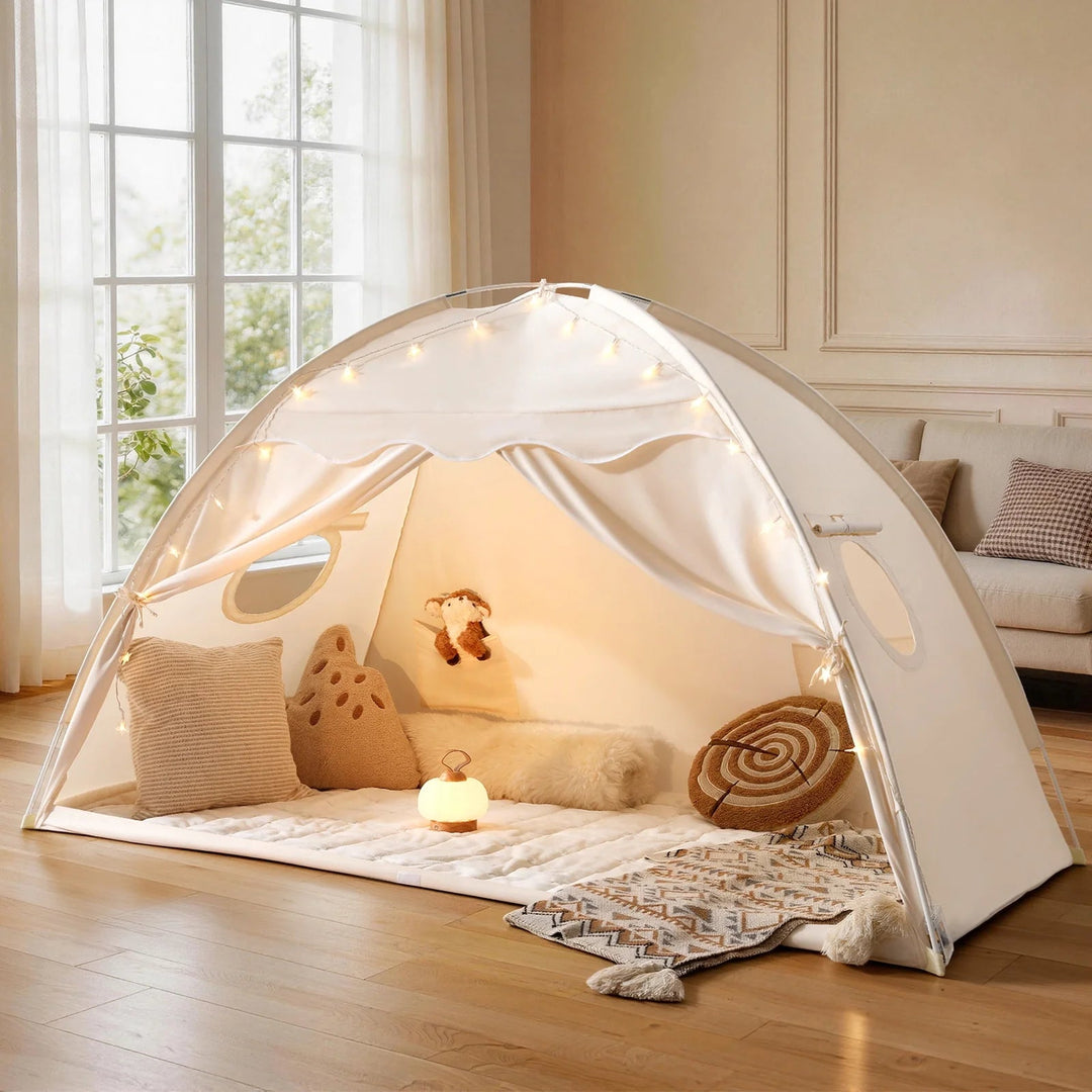 Sea Dragon Dreams boho cream kids play tent with string lights, plush pillows, and cozy floor mat in a bright room