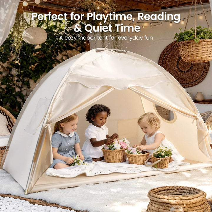 Three children playing with flowers inside a Sea Dragon Dreams boho cream indoor kids play tent on a white rug