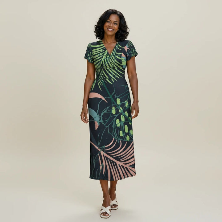 Sea Dragon Dreams botanical print midi dress with V-neck and flutter sleeves worn by a smiling woman in studio