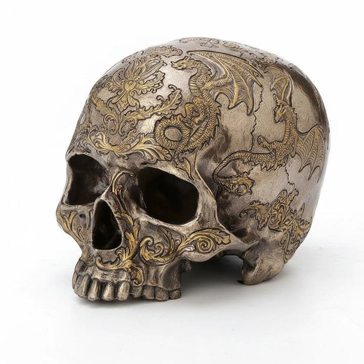 Sea Dragon Dreams cold-cast bronze skull figurine featuring intricate flying dragon and thistle coat of arms carvings.