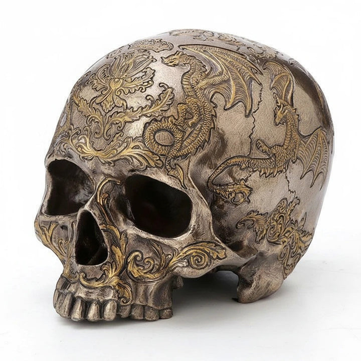 Sea Dragon Dreams cold-cast bronze skull figurine featuring intricate flying dragon and thistle coat of arms carvings.