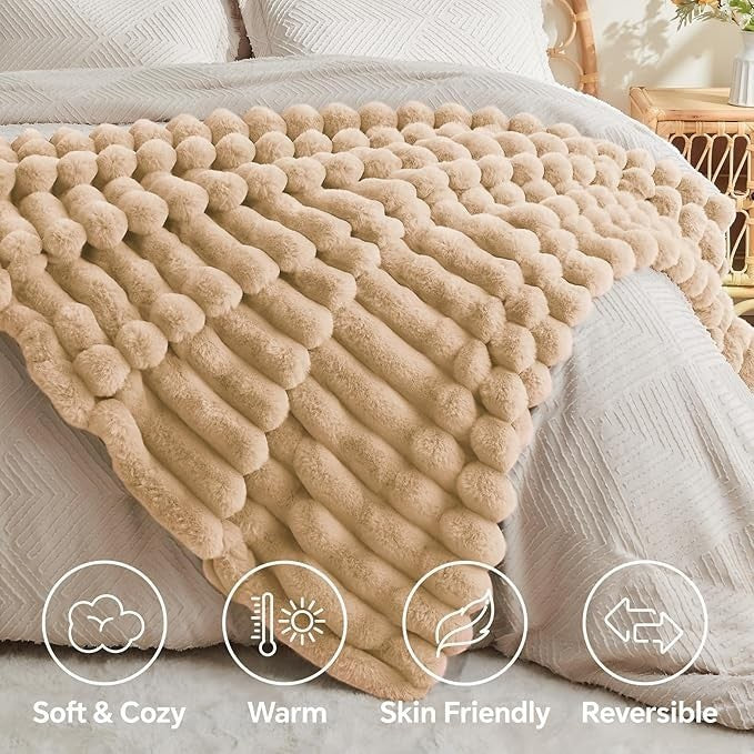 Sea Dragon Dreams brown faux rabbit fur throw blanket with 3D striped texture draped over a bed for cozy home decor.